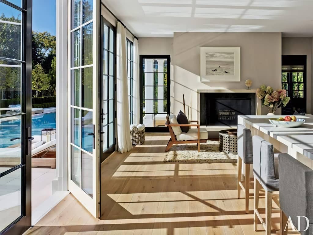 Sliding glass patio doors opening to an outdoor pool area